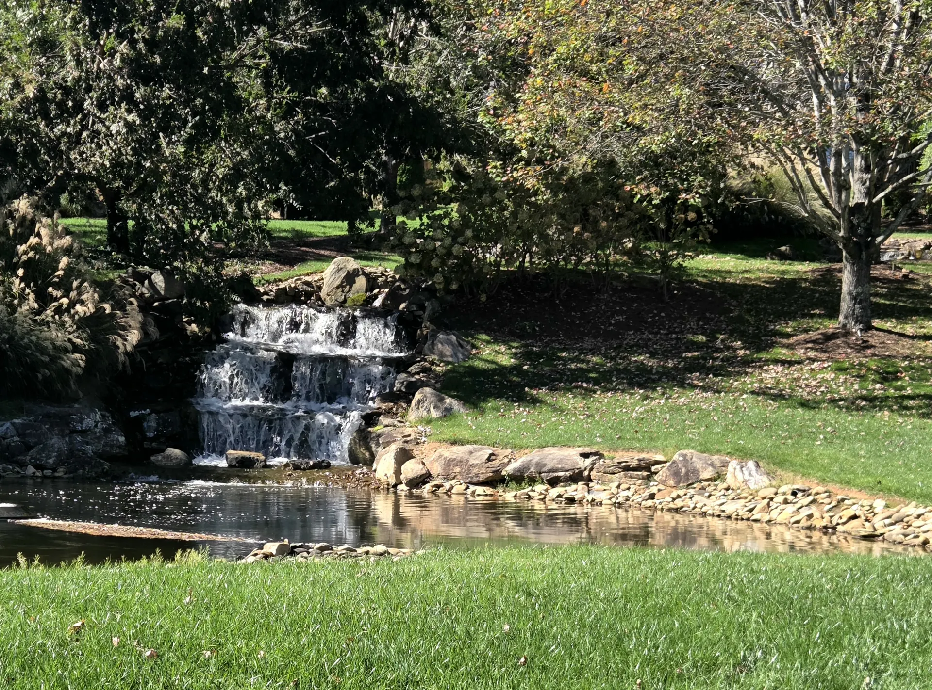 Waterfall and pond in The Meadow at The Cliffs at Walnut Cove